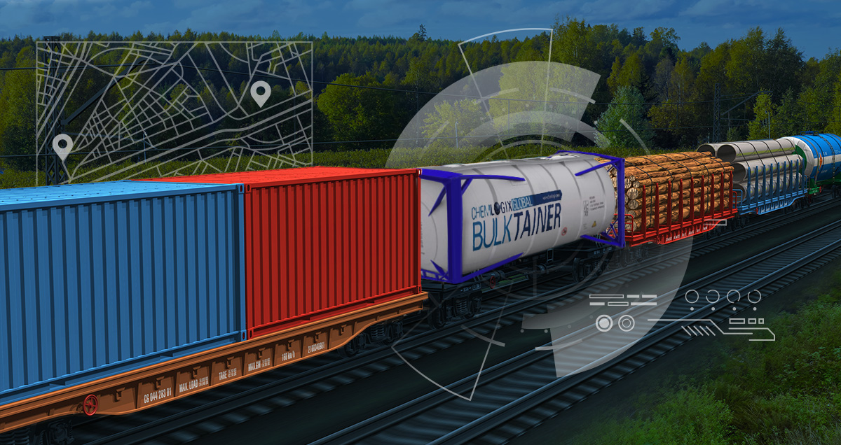 Rail cars on a track including freight containers, a car of logs, and a tank for liquid chemicals.